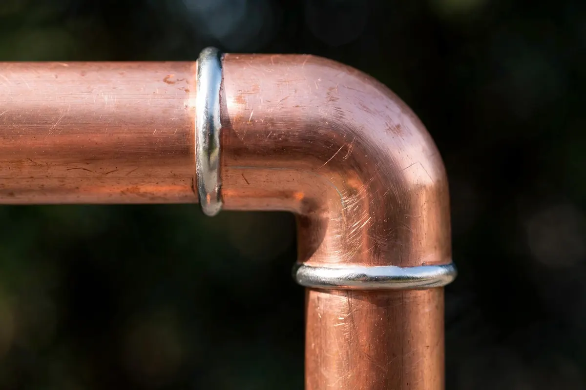 Split copper water pipe showing a longitudinal freeze crack in a Naugatuck home